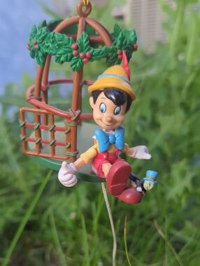 Pinocchio & Jiminy Cricket on a bird cage Enesco Christmas Moveable Ornament